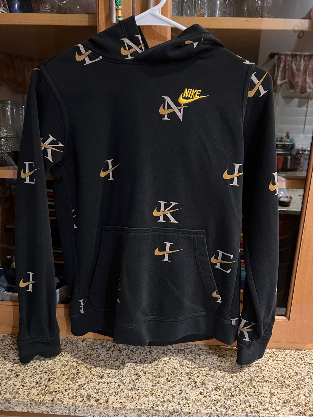 Nike KidsBlack Crewneck Hoodie with Gold Logo Accents
